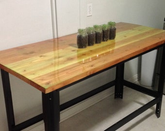 Farmhouse wood table with epoxy resin finish on a Repurposed workbench base