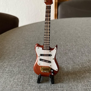 miniature guitar electric guitar with stand. Wood.  16 cms.