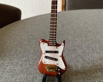miniature guitar electric guitar with stand. Wood.  16 cms.