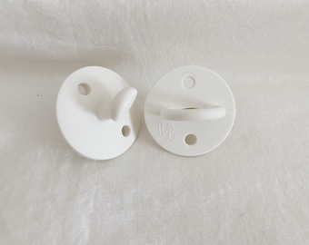 White Harleebeeandco pacifier, baby pacifier, silicone pacifier, baby paci, silicone, baby teether
