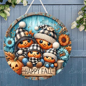 May include: A round wooden door hanger with a blue background and a fall theme. Four pumpkins with black and white checkered hats and scarves are arranged around a sign that reads "Happy Fall".
