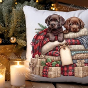 May include: Two brown Labrador puppies are nestled in a stack of blankets and plaid fabric. The puppies are surrounded by Christmas presents wrapped in brown paper and red and black plaid paper.