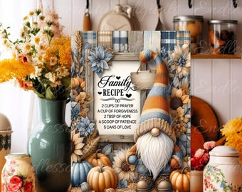 May include: A blue and orange gnome with a white beard stands in front of a wooden sign that reads "Family Recipe". The sign lists ingredients for a family recipe, including 2 cups of prayer, a cup of forgiveness, 2 tbsp of hope, a scoop of patience, and 5 cans of love. The gnome is surrounded by fall foliage, including sunflowers, pumpkins, and gourds.