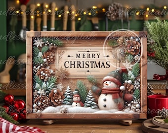 Könnte beinhalten: Eine Weihnachts-Szene in einem Holzrahmen mit einem Schneemann, Tannenzweigen, Tannenzapfen und einem Schild mit der Aufschrift "Frohe Weihnachten".