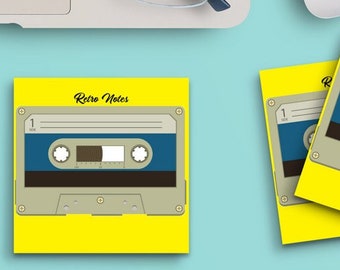 May include: Three yellow sticky notes with the text "Retro Notes" and a retro cassette tape design. The notes are on a light blue surface with a laptop, glasses, a mouse, a cup of coffee, and paper clips.