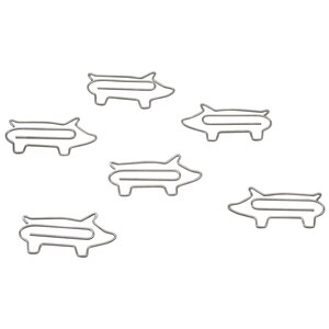 May include: Six silver pig-shaped paper clips. The clips are all the same size and shape, and they are arranged in a random pattern on a white background.