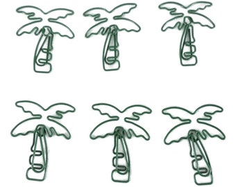 May include: Six green wire palm tree shaped paper clips. The paper clips are made of wire and are shaped like palm trees. They are a fun and unique way to add a touch of whimsy to your desk or office.