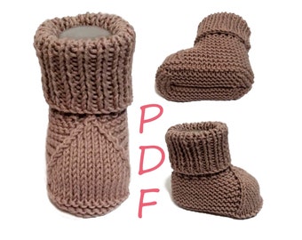 May include: A pair of knitted baby booties in a light brown color. The booties have a fold-over cuff and a pointed toe.