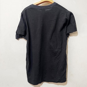 May include: A black short-sleeved t-shirt with a crew neck.