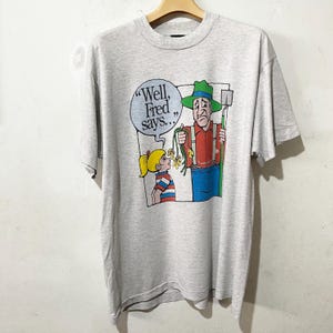 90年代ヴィンテージファーマーTシャツ「まあ、フレッドは言う」面白いコミックグラフィックTシャツサイズL