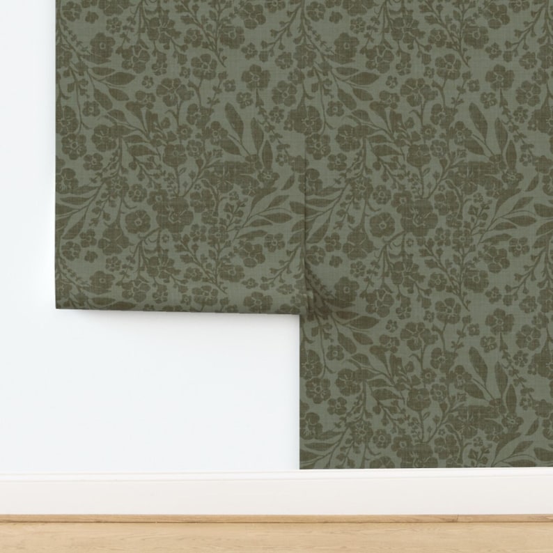 1. Green floral wallpaper featuring intricate patterns of leaves and flowers on a soft background.   2. A vibrant green floral wallpaper showcasing a delicate design of various flowers and foliage.  3. Elegant green floral wallpaper adorned with a detailed pattern of blooming flowers and lush leaves.