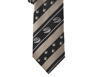 May include: A black and gold striped tie with a dinosaur skull and footprint pattern.