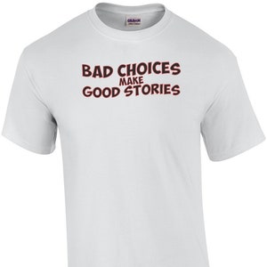 May include: White t-shirt with the text "Bad Choices Make Good Stories" printed in red and black.