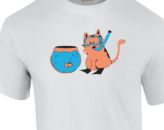 May include: A white t-shirt featuring a cartoon illustration of an orange cat wearing a snorkel and flippers, looking at a fishbowl with a fish inside.