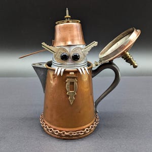 Found object good luck gremlin in teapot - Assemblage art sculpture - Upcycled art