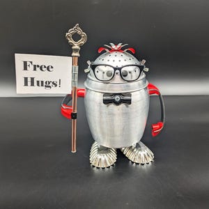 Android robot with Free Hugs sign - Found object robot - Assemblage art - Upcycled Recycled sculpture