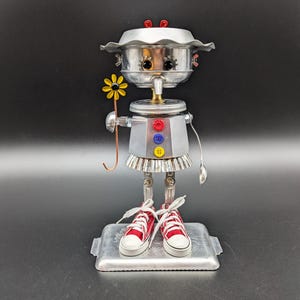 Girl offering daisy  - found object robot art - recycled sculpture - assemblage art