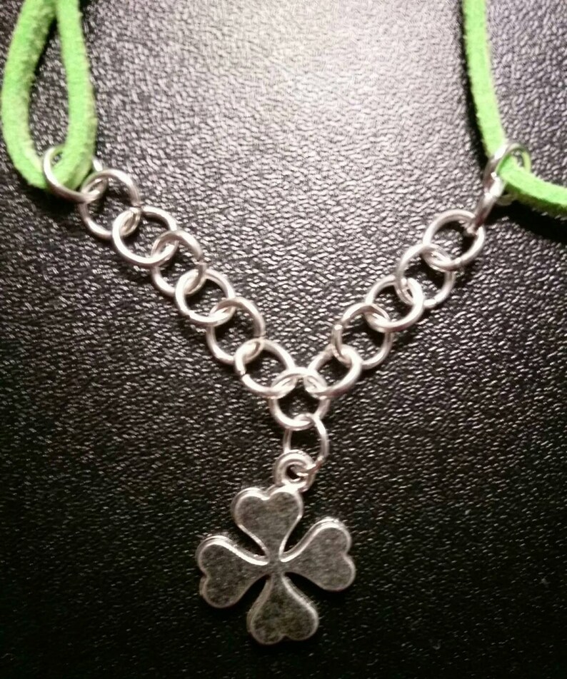 Green suede bracelet with shamrock charm