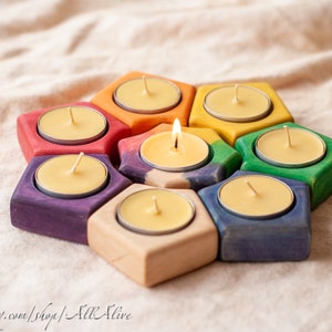 Juego de 8 candelabros inspirados en el sol de Waldorf para velas de té, con rayo blanco y portavelas de color degradado. Ideal para guarderías.