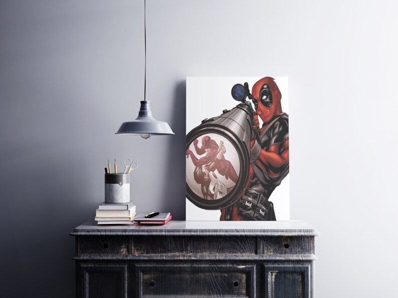 May include: A red and black superhero character, Deadpool, is holding a large, black, cylindrical weapon with a scope. The scope is pointed at a scene of two figures fighting. The background is white.