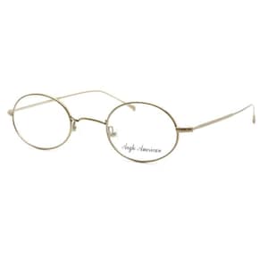 May include: Gold-rimmed oval eyeglasses with clear lenses. The brand name "Angle American" is printed on the right lens.