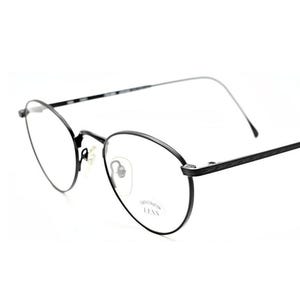 Puede incluir: Gafas de metal negro con montura redonda. Las gafas tienen una montura de metal fina y están diseñadas para el uso diario.