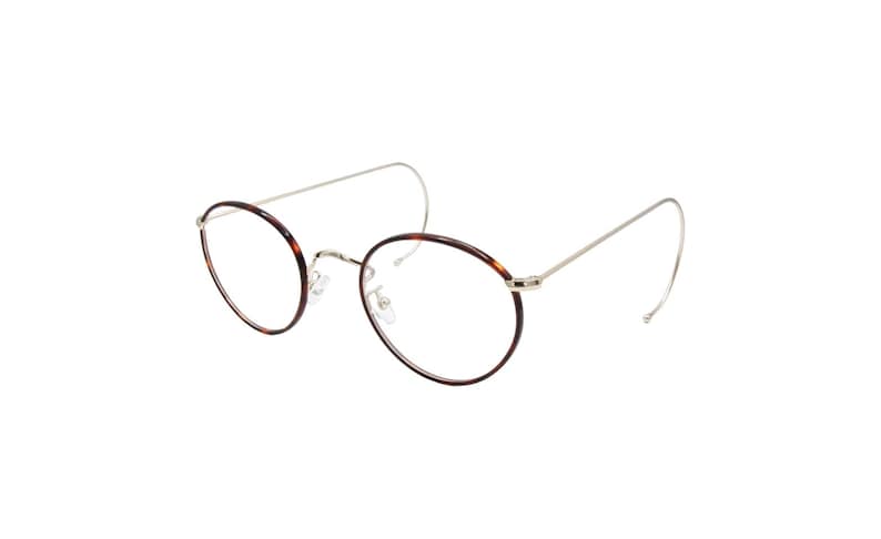 May include: Oval-shaped eyeglasses with a tortoiseshell pattern on the rims and a thin, silver-colored metal frame. The temples curve behind the ears. The lenses are clear.