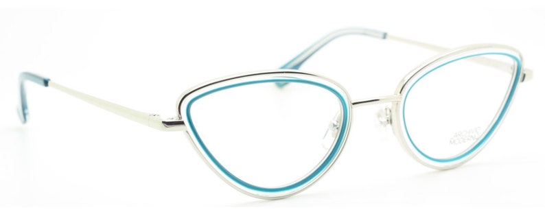 May include: Silver cat-eye glasses with a blue trim around the lenses.