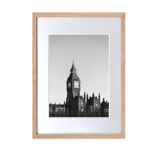 a black and white photo of a clock tower
