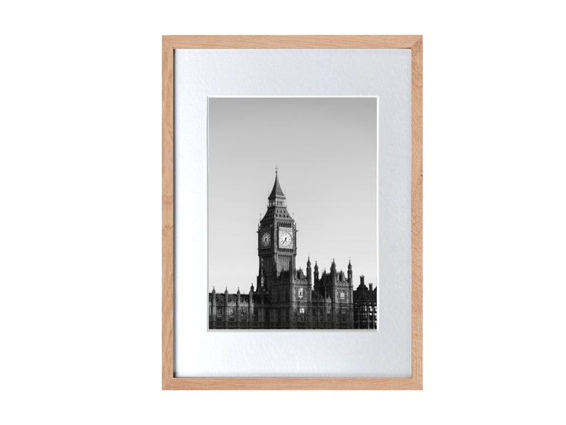 a black and white photo of a clock tower