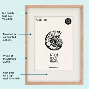 The image is a detailed diagram of a framed picture, highlighting its features such as the top quality solid oak moulding, mounted or unmounted options, the width of the moulding, and the handcrafted nature of the frames.
