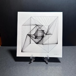 May include: A black and white geometric line drawing of a cube with a complex, overlapping design. The drawing is on a white background and is framed with a thin black border.