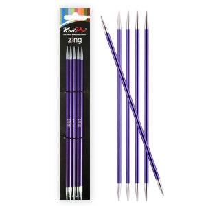 May include: Set of five purple knitting needles with silver tips. The needles are labeled "Knit Pro Zing".