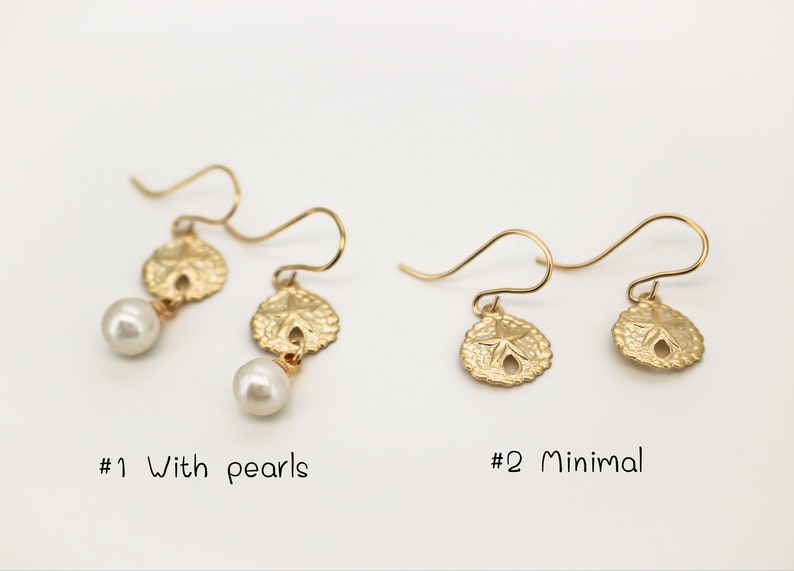 May include: Two pairs of gold earrings with a sand dollar design. The first pair features a pearl dangling below each sand dollar. The second pair is minimal with just the sand dollar design. The text '#1 With pearls' and '#2 Minimal' is below each pair of earrings.