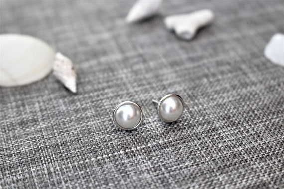 flat pearl earrings