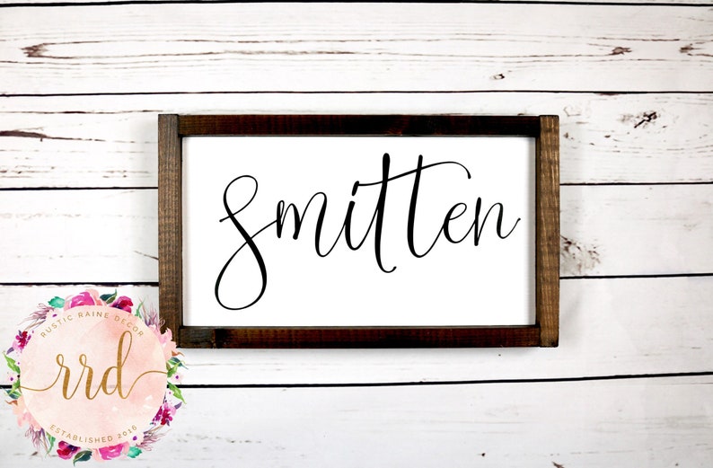 General Home Smitten Hand-Painted Framed Wood Sign Dark Stained Wooden Frame White Background and Black Lettering