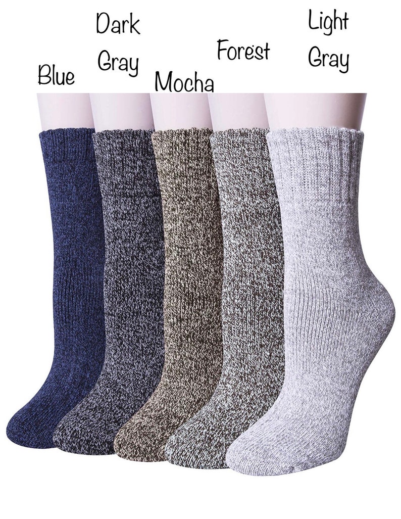 May include: Six pairs of ankle socks in a variety of colours, including blue, dark grey, mocha, forest, and light grey. The socks are made from a soft, textured material and have a ribbed cuff.