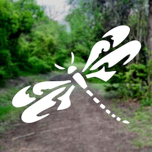 May include: White silhouette of a dragonfly with intricate wing designs, set against a blurred background of green foliage.