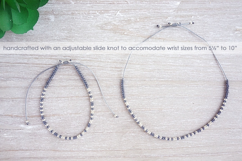 May include: Two beaded bracelets with a silver and black color scheme. The bracelets are made with an adjustable slide knot to fit wrist sizes from 5 1/2 inches to 10 inches.