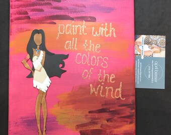 May include: A pink canvas painting with a cutout of Pocahontas from Disney's Pocahontas. The background is painted with a sunset of orange, yellow, and red. The words "paint with all the colors of the wind" are written in gold glitter on the canvas.