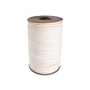 May include: A spool of white leather cord wrapped around a brown cardboard spool.
