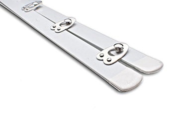 May include: White plastic bra strap extenders with metal hooks and eyes. The extenders are designed to lengthen bra straps.