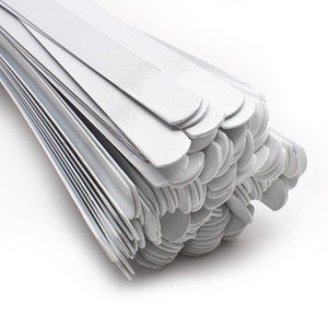 May include: A bundle of white wooden craft sticks, stacked and bundled together. The sticks are all the same size and shape, and they are arranged in a neat and orderly fashion.