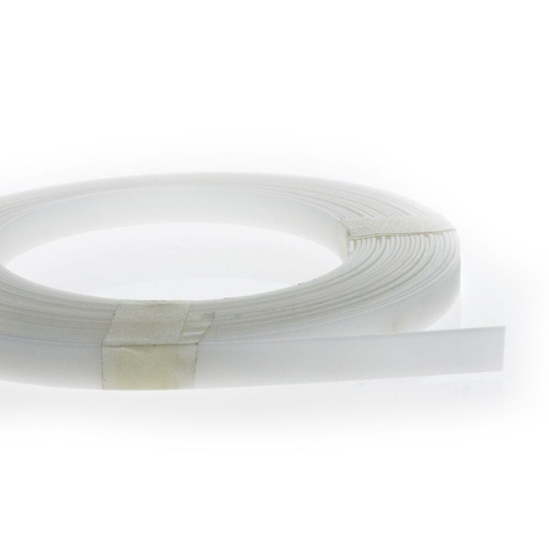 May include: A roll of white plastic banding, used for securing packages and bundles.