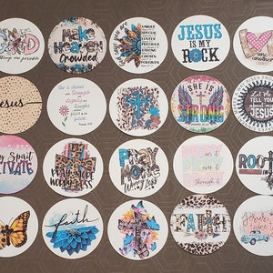 May include: A set of 16 round stickers with various Christian-themed designs. The stickers feature colorful backgrounds, inspirational quotes, and religious symbols. Some of the designs include a cross, a butterfly, and a heart.