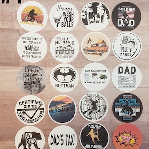 May include: A set of 16 round coasters with various designs and sayings. The coasters feature a variety of themes, including fishing, camping, and fatherhood. Some of the sayings include "I Make Beer Disappear", "Always Wash Your Balls", "I'm a Mechanic", "Gotta Love a Good Pole Dance", "Dad's Taxi", and "Super Dad".