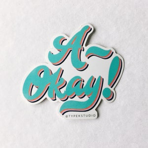 Um ok! Adesivo