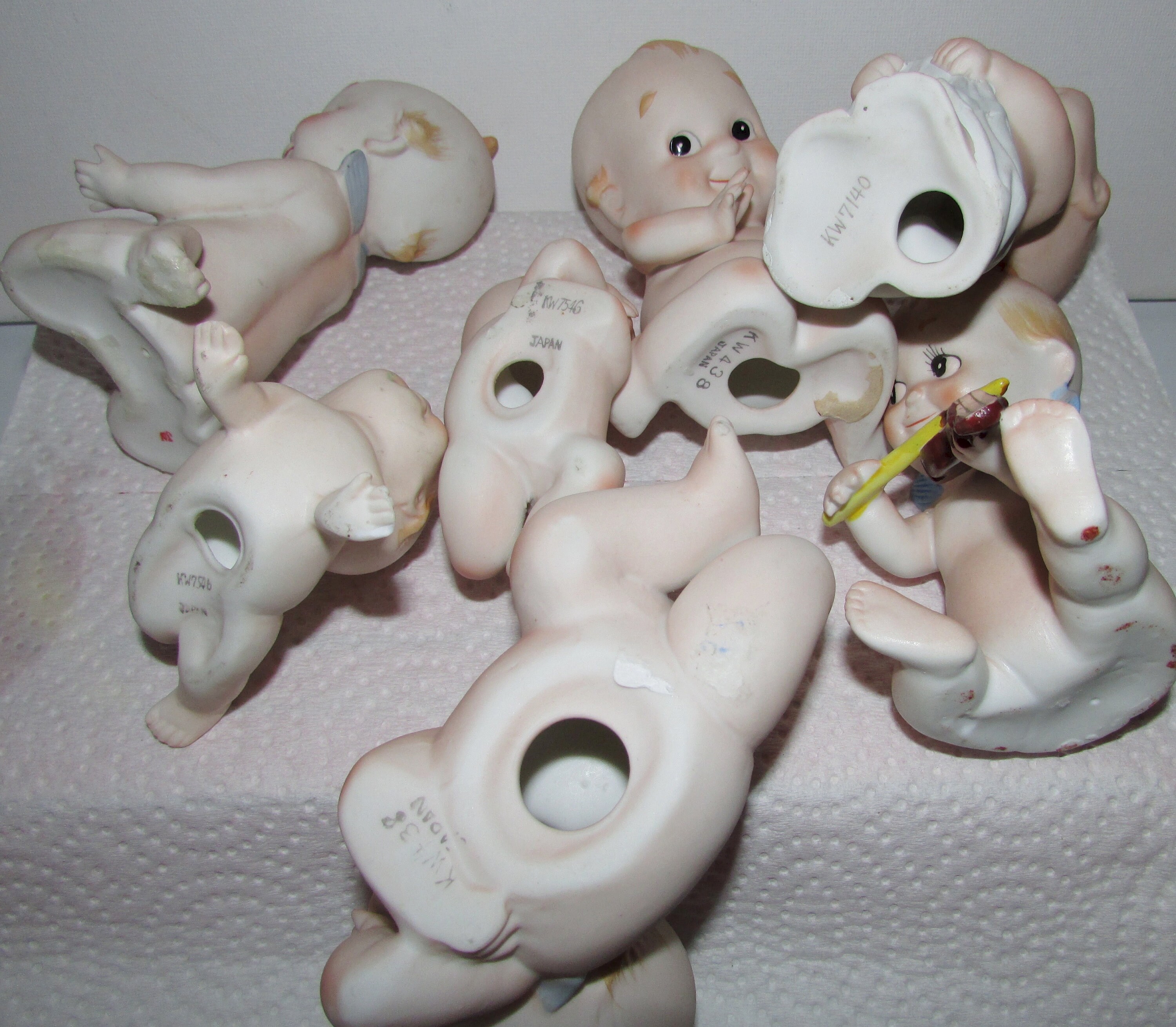 Vtg Collectable Group of 7 Bisque Kewpie Baby Stamped