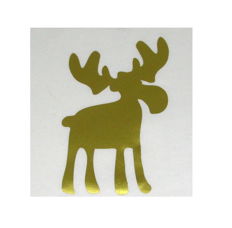 May include: A gold-colored moose silhouette sticker. The moose is standing with its legs spread apart and its head tilted to the side.