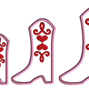 May include: Three pink cowboy boots with red hearts and swirls on the front. The boots are different sizes, with the smallest boot on the left and the largest boot on the right.